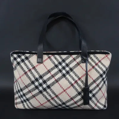 BURBERRY - Sac à main en tricot beige, noir, rouge, double anse porté épaule, fermeture zippée, poche.